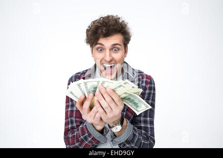 Porträt eines fröhlichen jungen Mannes hält Rechnungen von Dollar Stockfoto