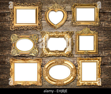 Barockstil golden Frames über rustikalen hölzernen Hintergrund. Antike Objekte Stockfoto