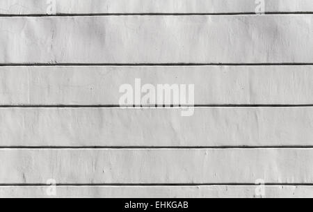Hintergrundtextur weiße Betonwand mit horizontalen Linien dekorative relief Stockfoto