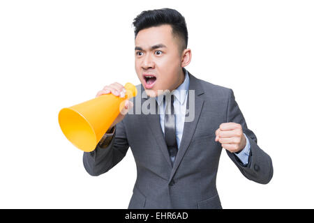 Junger Geschäftsmann in Megaphon schreien Stockfoto