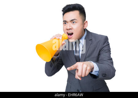 Junger Geschäftsmann in Megaphon schreien Stockfoto