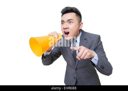 Junger Geschäftsmann in Megaphon schreien Stockfoto