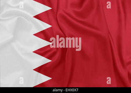 Bahrain - winken Nationalflagge auf Seide Textur Stockfoto