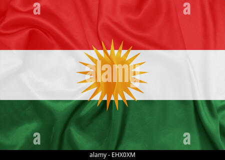 Kurdistan - winken Nationalflagge auf Seide Textur Stockfoto