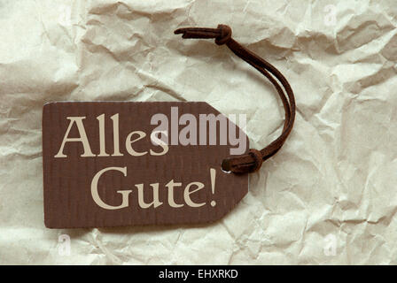 Beste Mittel eine braune Label oder Etikett mit braunen Band auf zerknittertes Papierhintergrund mit deutschem Text Alles Gute wünscht, Vintage oder R Stockfoto