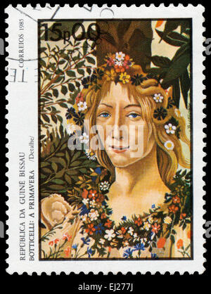 Guinea-Bissau - ca. 1985: Briefmarke gedruckt in Guinea-Bissau zeigt Frühjahr von Botticelli, ca. 1985 Stockfoto