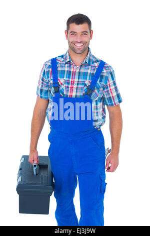 Glücklich Heimwerker in Overalls tragen toolbox Stockfoto