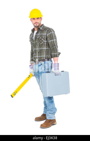 Arbeiter mit Wasserwaage und toolbox Stockfoto