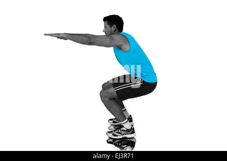 Zusammengesetztes Bild der Seitenansicht eines Fit jungen Mannes tun stretching-Übung Stockfoto