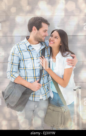 Zusammengesetztes Bild attraktives junges Paar geht auf ihren Urlaub Stockfoto