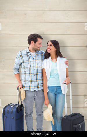 Zusammengesetztes Bild attraktives junges Paar geht auf ihren Urlaub Stockfoto