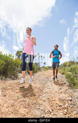 Zusammengesetztes Bild Fit attraktives Paar Jogging Bergpfad hinab Stockfoto