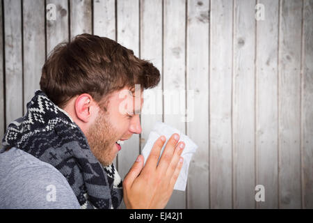 Zusammengesetztes Bild Nahaufnahme Seitenansicht des Mannes Nase weht Stockfoto