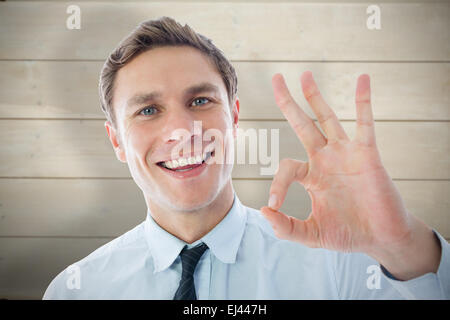 Zusammengesetztes Bild des Kaufmanns ok Anzeichen Stockfoto