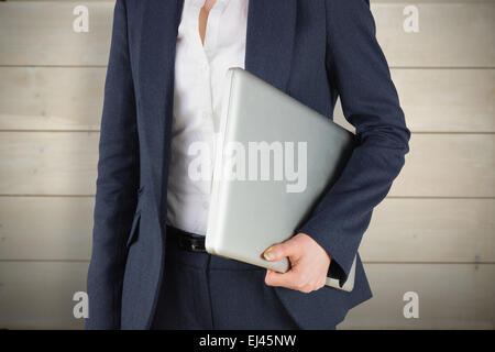 Zusammengesetztes Bild der Geschäftsfrau mit laptop Stockfoto