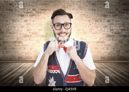 Zusammengesetztes Bild geeky Hipster mit Weihnachten Weste Stockfoto