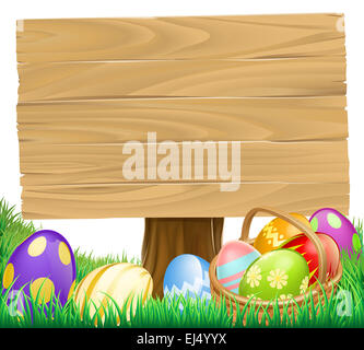 Easter Egg Holzschild mit einem Korb behindern voller Eier Stockfoto