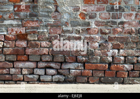 Hintergrundtextur des alten roten und dunklen grauen Mauer Stockfoto