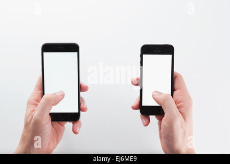 Mann mit smartphones Stockfoto