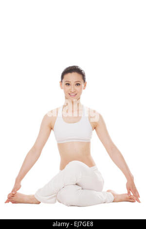 Die junge Frau tut yoga Stockfoto