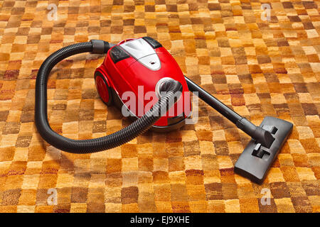 Staubsauger auf Teppich Stockfoto