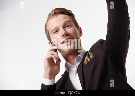 Geschäftsmann in Gläsern mit einem Telefon winken Stockfoto