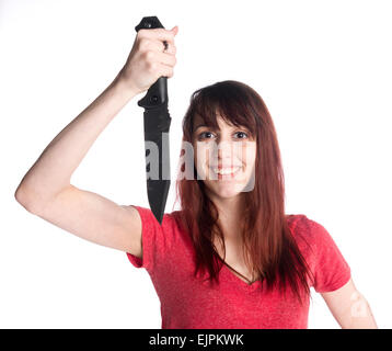 Lächelnde Frau mit Messer, Blick in die Kamera Stockfoto