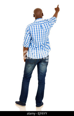 Heckansicht des afroamerikanischen Jüngling zeigt auf leere Textfreiraum Stockfoto