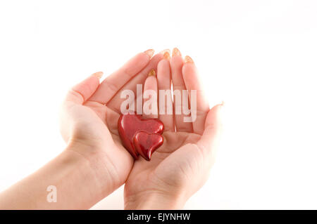Herzen in einer Hand Stockfoto