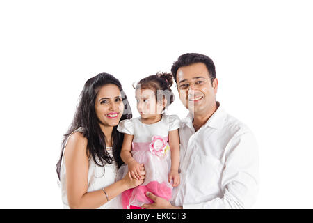 indische Eltern und Tochter sitzen Zuhause Stockfoto