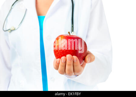 Zahnarzt hält einen Reifen Apfel gut für das Zahnfleisch Stockfoto