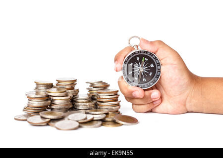 Nahaufnahme der Hand mit Kompass und Münze Stack, Business-Konzept Stockfoto