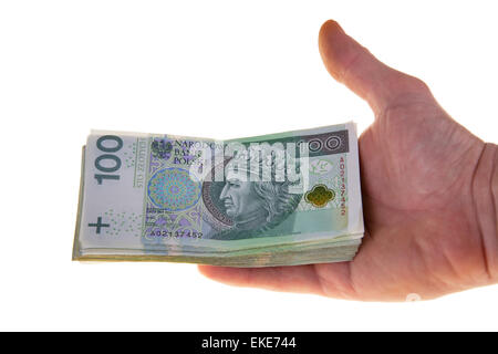 Polnische Währung Banknoten hundert Zloty, gehalten in der hand, isolierten auf weißen Hintergrund, close-up Stockfoto