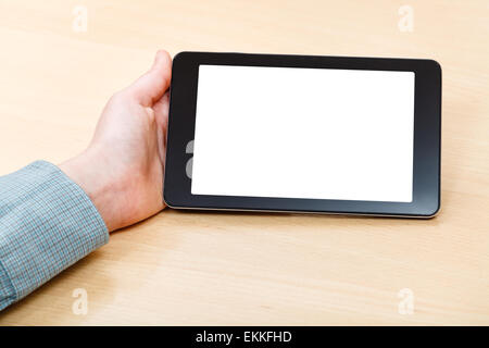 Geschäftsmann Hand und Tablet-PC mit isolierten Bildschirm am Schreibtisch Stockfoto