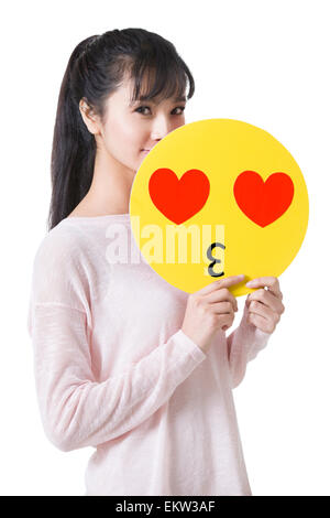 Junge Frau mit einer romantischen Emoticon-Gesicht Stockfoto