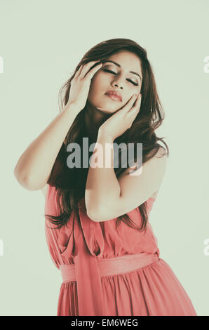 Beautiful young woman hands touching hair Stockfoto