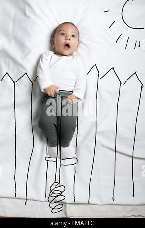 Niedliche Baby Boy auf Pogo Stick Dekoration Skizze Stockfoto