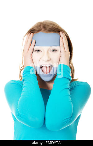 Frau mit der argentinischen Flagge auf Gesicht. Stockfoto