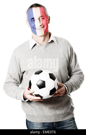 Reifer Mann mit Frankreich Flagge am Gesicht. Stockfoto