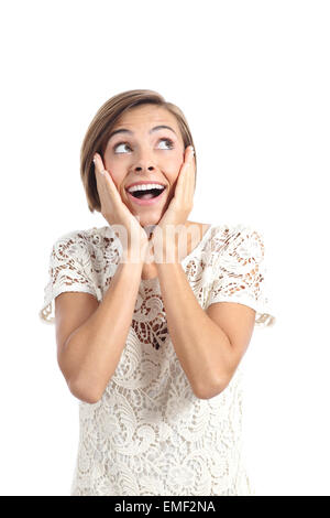 Glücklich schockiert Frau betrachten Seite mit Händen auf Gesicht isoliert auf weißem Hintergrund Stockfoto