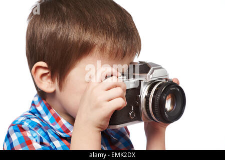 Kleine junge Fotografen schießen mit SLR Kamera isolierten Nahaufnahme Stockfoto