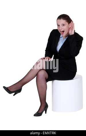 Geschäftsfrau, die kämpfen, um zu hören Stockfoto