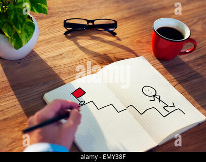Geschäftsmann Zeichnung Ziel Konzept auf einen Notizblock Stockfoto