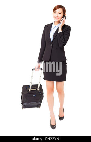Geschäftsfrau, die Reisen mit Koffer isoliert Stockfoto
