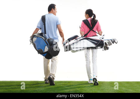 Ein paar mittleren Alters Golf Tragetasche Stockfoto