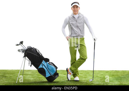 Der junge Mann spielt golf Stockfoto
