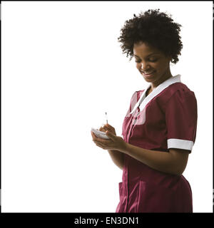 Kellnerin nehmen Bestellung Stockfoto