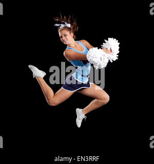 Studio shot der Cheerleader (16-17) springen Stockfoto