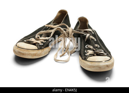 Alte dreckige getragene paar Leinenschuhe mit verknoteten Schnürsenkel, Isolated on White Background. Stockfoto