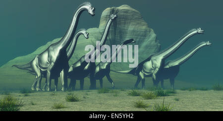 Eine Herde von Brachiosaurus Dinosaurier übergeben eine hohen Klippe auf der Suche nach einen Wald von Bäumen für die Beweidung. Stockfoto